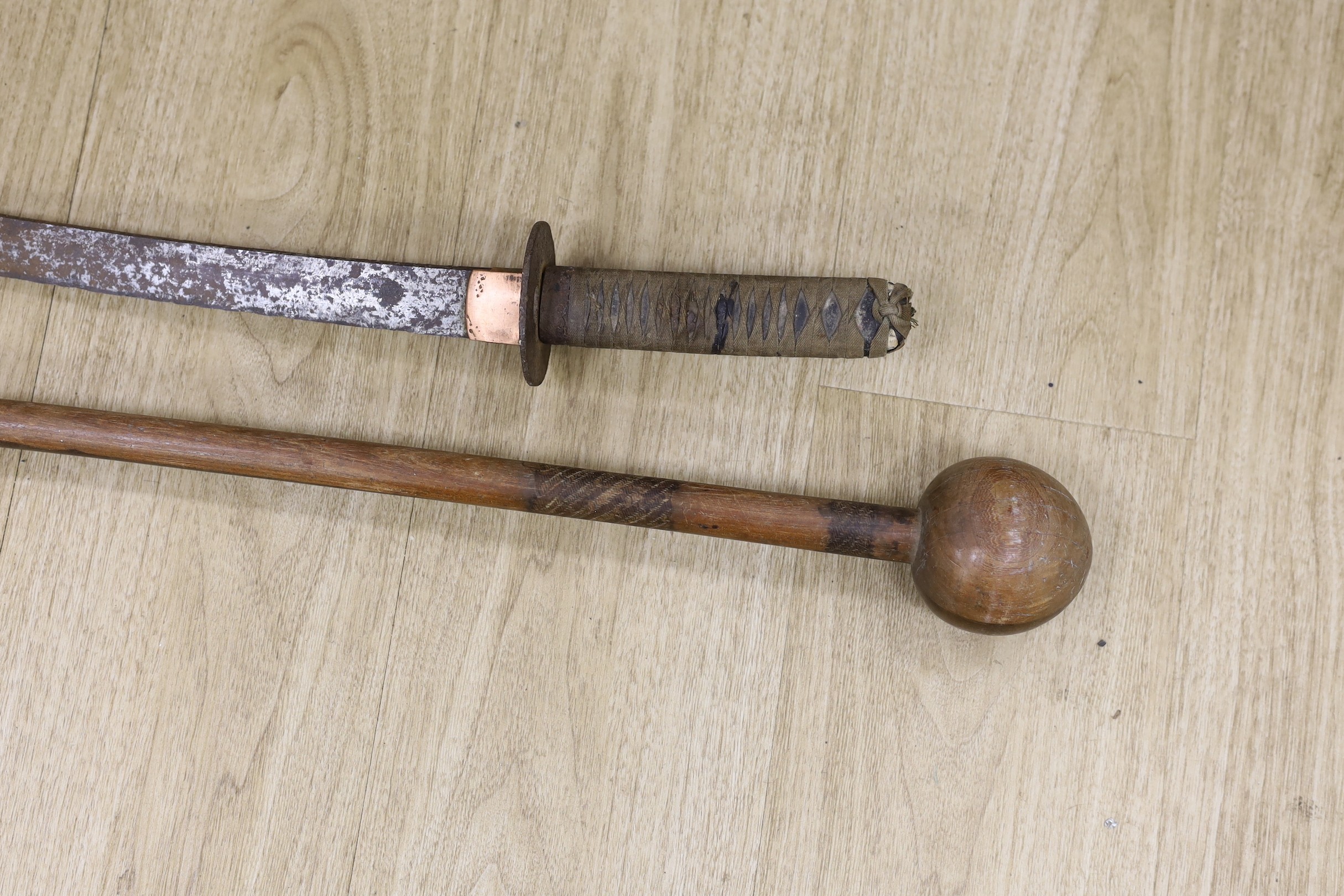 A Japanese wakizashi (corroded) with signed tang and a South African ebony knobkerrie, 80cm long